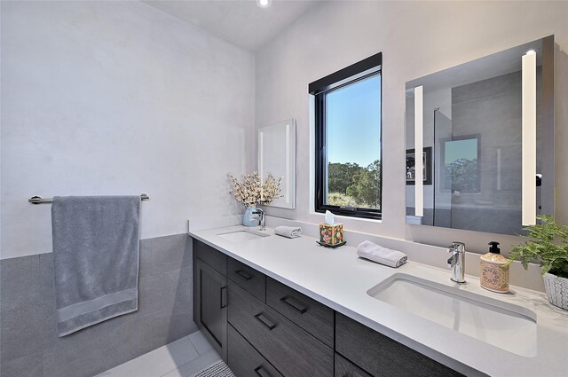 full bathroom featuring double vanity and tile patterned flooring