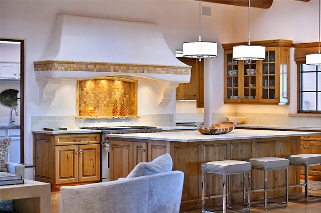 interior space featuring beamed ceiling, wood ceiling, a fireplace, and a skylight