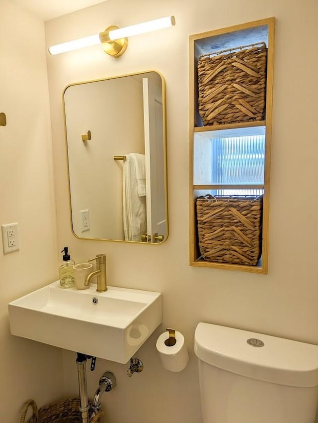 bathroom with toilet and sink