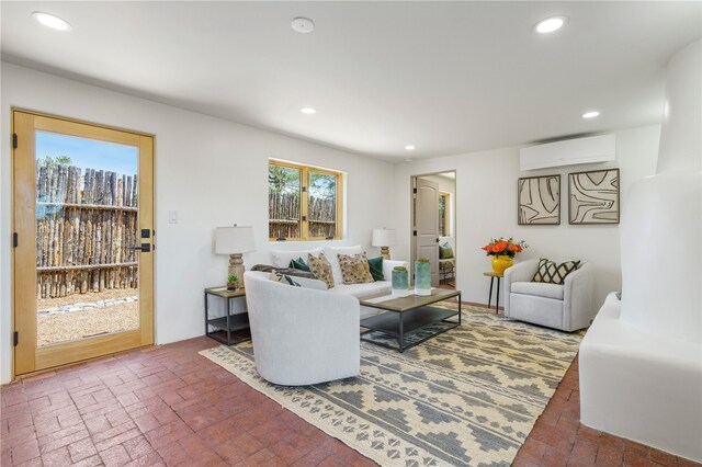 living room with a wall mounted air conditioner