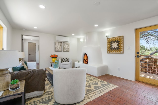 living room with a wall mounted air conditioner