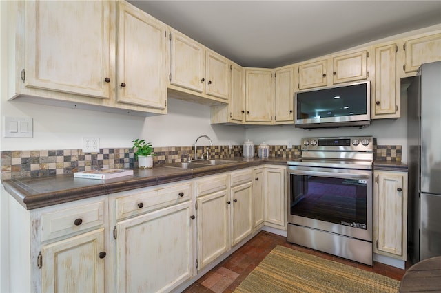 kitchen with sink and appliances with stainless steel finishes