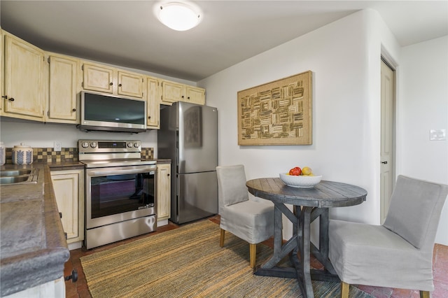 kitchen with sink and appliances with stainless steel finishes