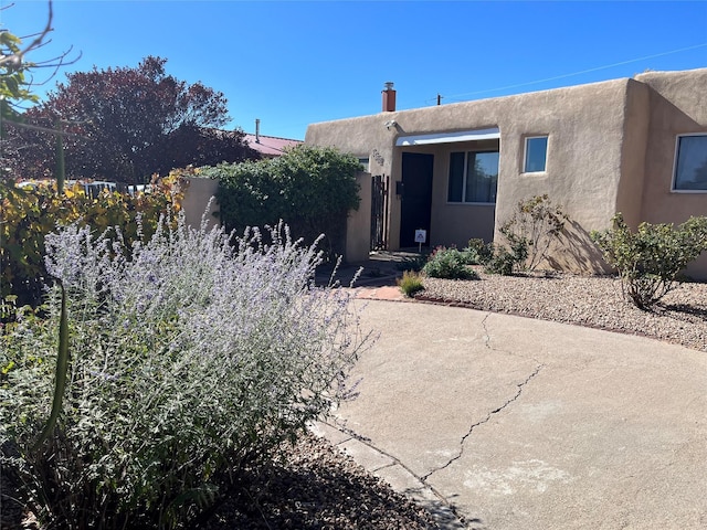 adobe home with a patio