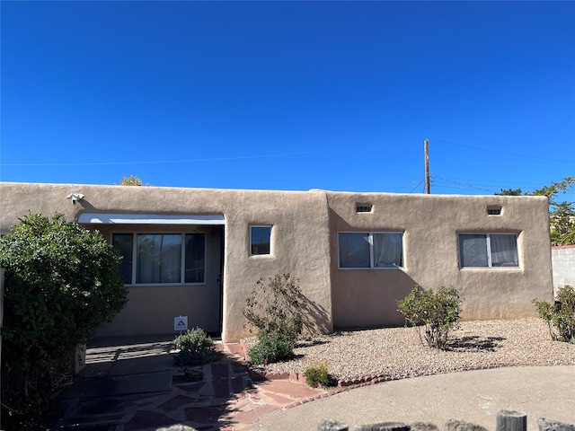 view of front of property featuring a patio