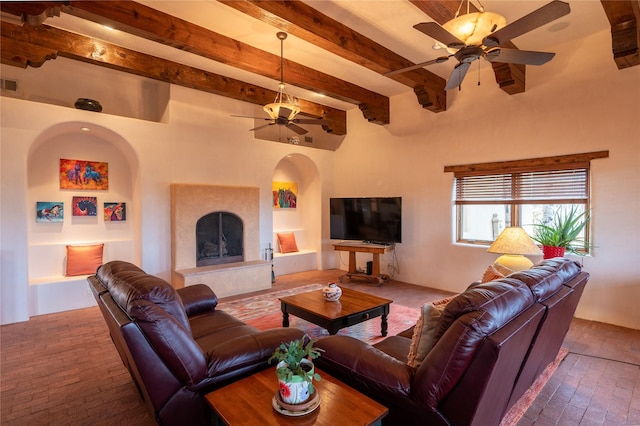 living room with ceiling fan and beam ceiling