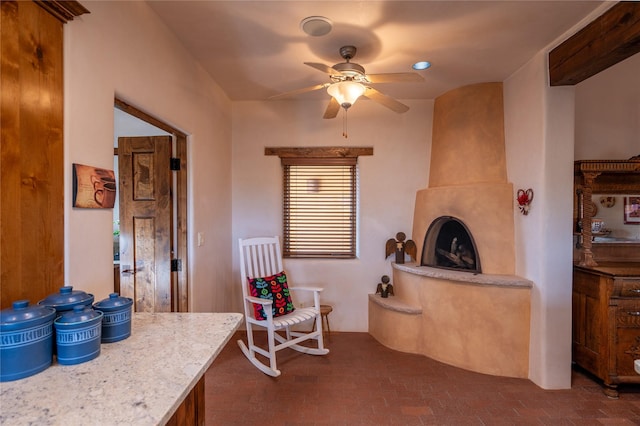 interior space with ceiling fan