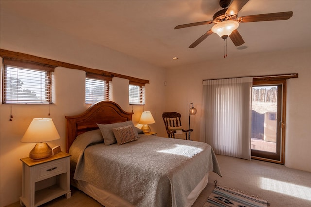 bedroom featuring ceiling fan and carpet