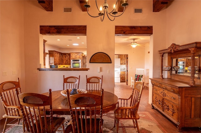 dining space with beamed ceiling, ceiling fan with notable chandelier, and light wood-type flooring