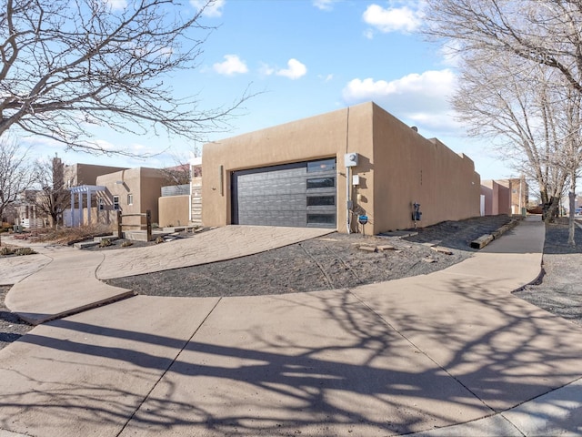 view of side of home featuring a garage