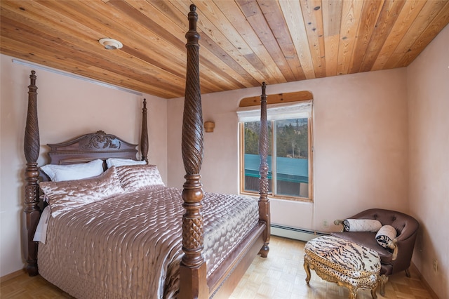 bedroom with light parquet floors and a baseboard radiator