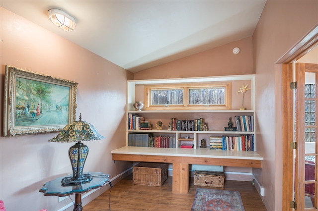 sitting room featuring hardwood / wood-style floors and lofted ceiling