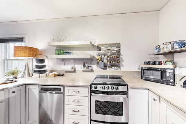 kitchen featuring white cabinets, stainless steel appliances, and ornamental molding