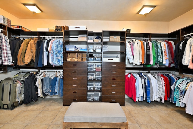 walk in closet featuring light tile patterned floors