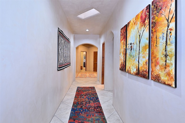 hallway with light tile patterned floors