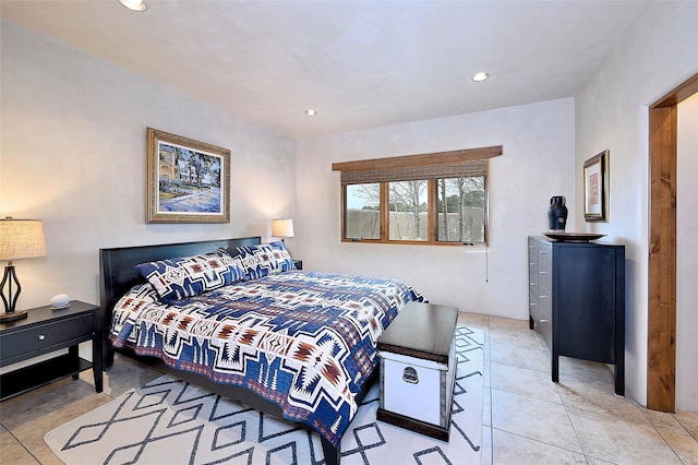 bedroom with light tile patterned floors