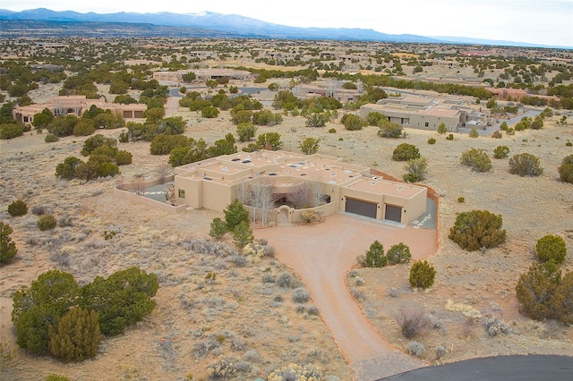 birds eye view of property with a mountain view