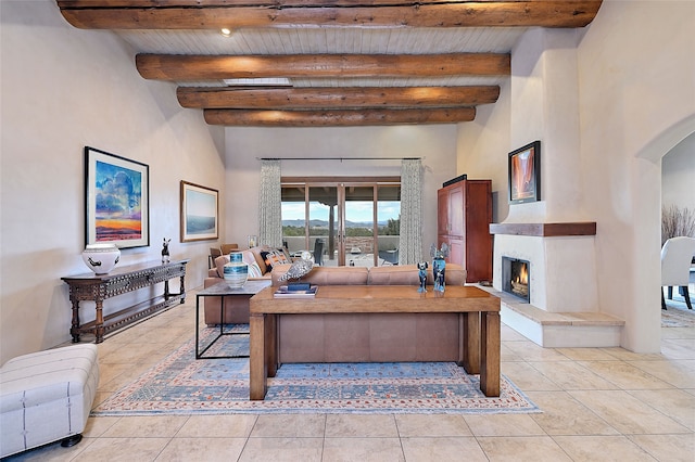 living room featuring beamed ceiling, wood ceiling, and light tile patterned floors