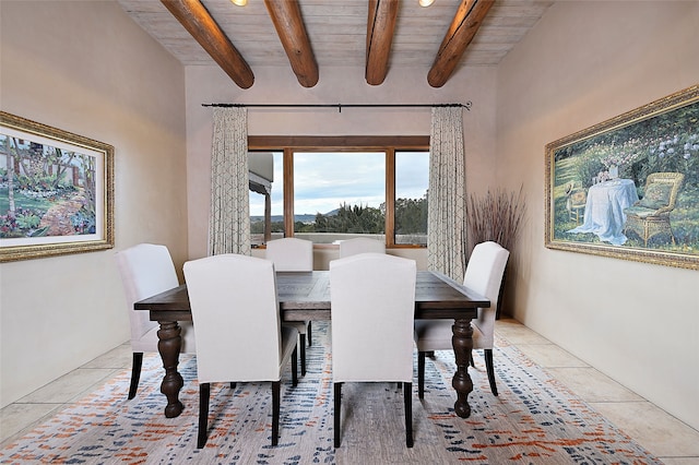 dining area featuring beamed ceiling and wood ceiling