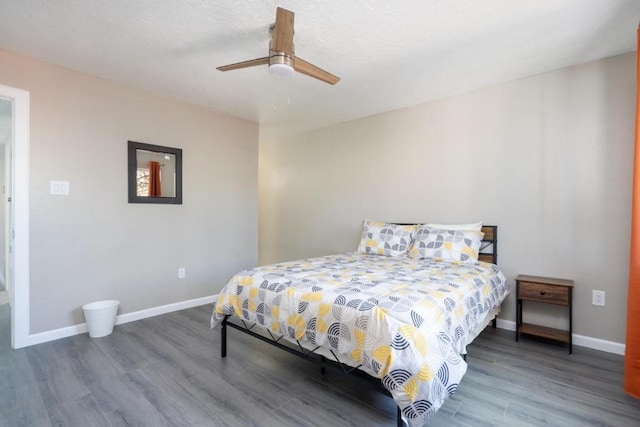 bedroom featuring ceiling fan and wood-type flooring