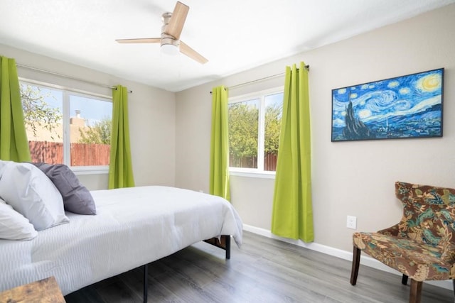 bedroom featuring hardwood / wood-style floors and ceiling fan