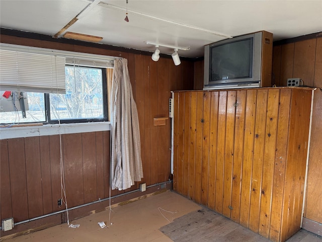 kitchen with rail lighting and wooden walls