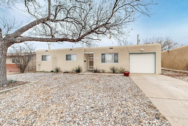 southwest-style home with a garage