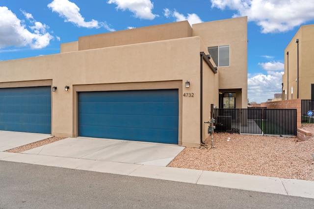 adobe home featuring central AC unit