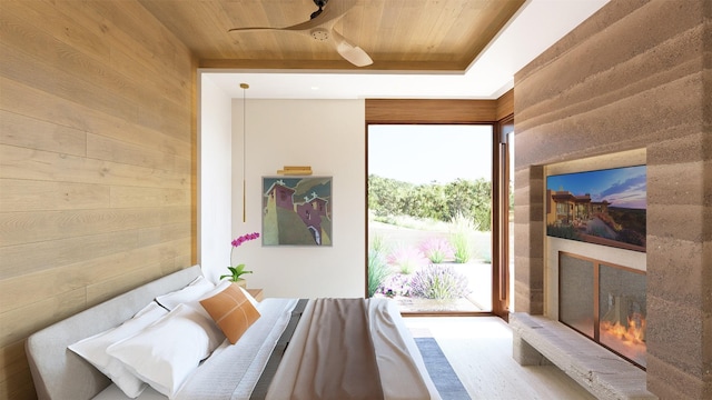 interior space featuring hardwood / wood-style floors, ceiling fan, wood ceiling, and wooden walls