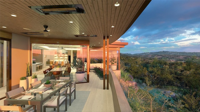 balcony at dusk with ceiling fan