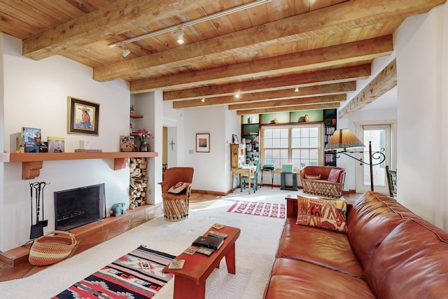 living room with beam ceiling, wood ceiling, and track lighting