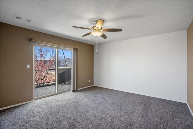 spare room with carpet flooring, ceiling fan, and a textured ceiling