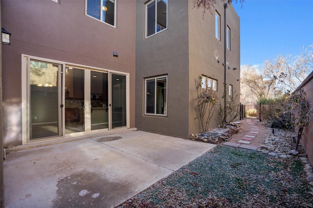 rear view of house with a patio