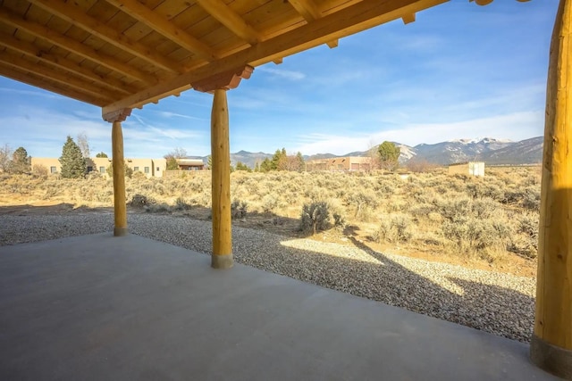 view of patio / terrace with a mountain view