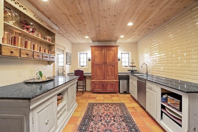 kitchen featuring wood ceiling, dishwasher, light tile patterned floors, sink, and white cabinetry