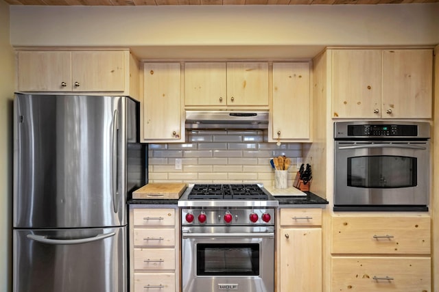 kitchen featuring appliances with stainless steel finishes, decorative backsplash, and light brown cabinets