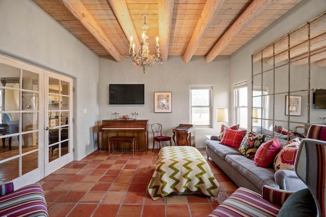 tiled living room with wood ceiling, an inviting chandelier, french doors, and beamed ceiling