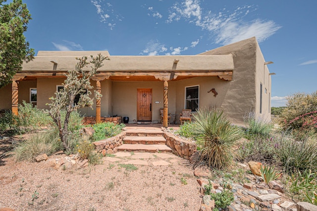 view of adobe home