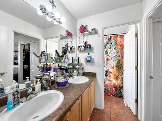 bathroom featuring a chandelier, vanity, and tile patterned floors