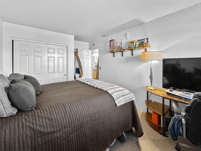 carpeted bedroom featuring a closet