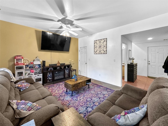 tiled living room featuring ceiling fan