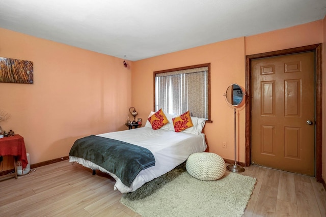 bedroom with light hardwood / wood-style flooring