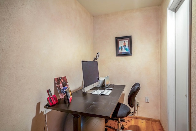 home office featuring hardwood / wood-style floors