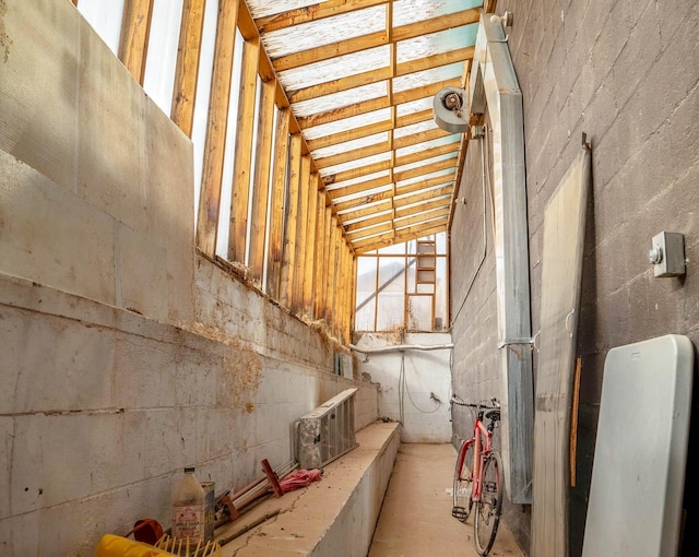 miscellaneous room featuring high vaulted ceiling