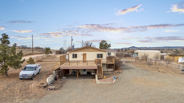 view of front of house with a deck