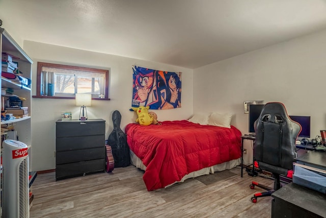 bedroom with light wood-type flooring