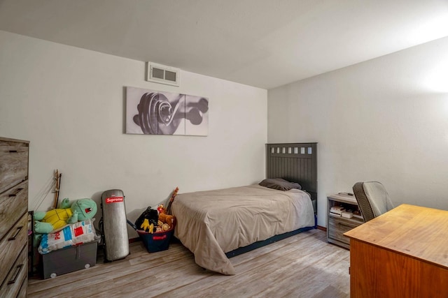 bedroom with light hardwood / wood-style flooring