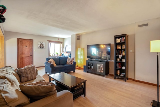 living room with light hardwood / wood-style floors