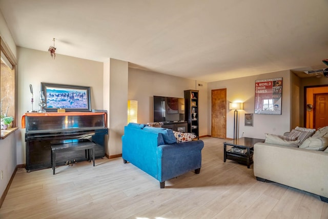 living room with light hardwood / wood-style flooring