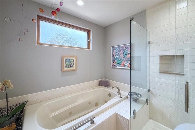 bathroom with shower with separate bathtub